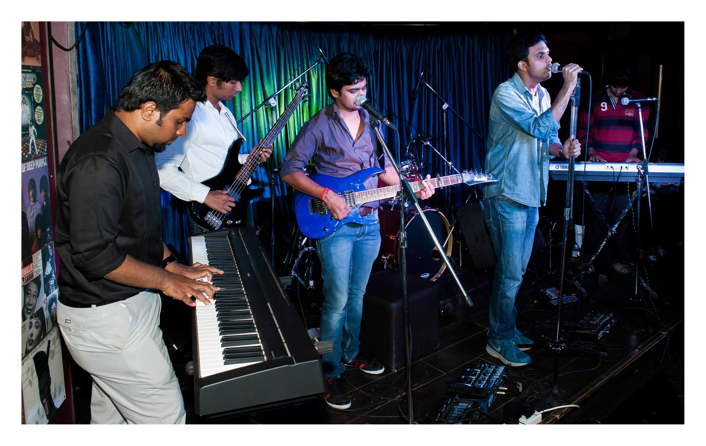 Full band performing on stage