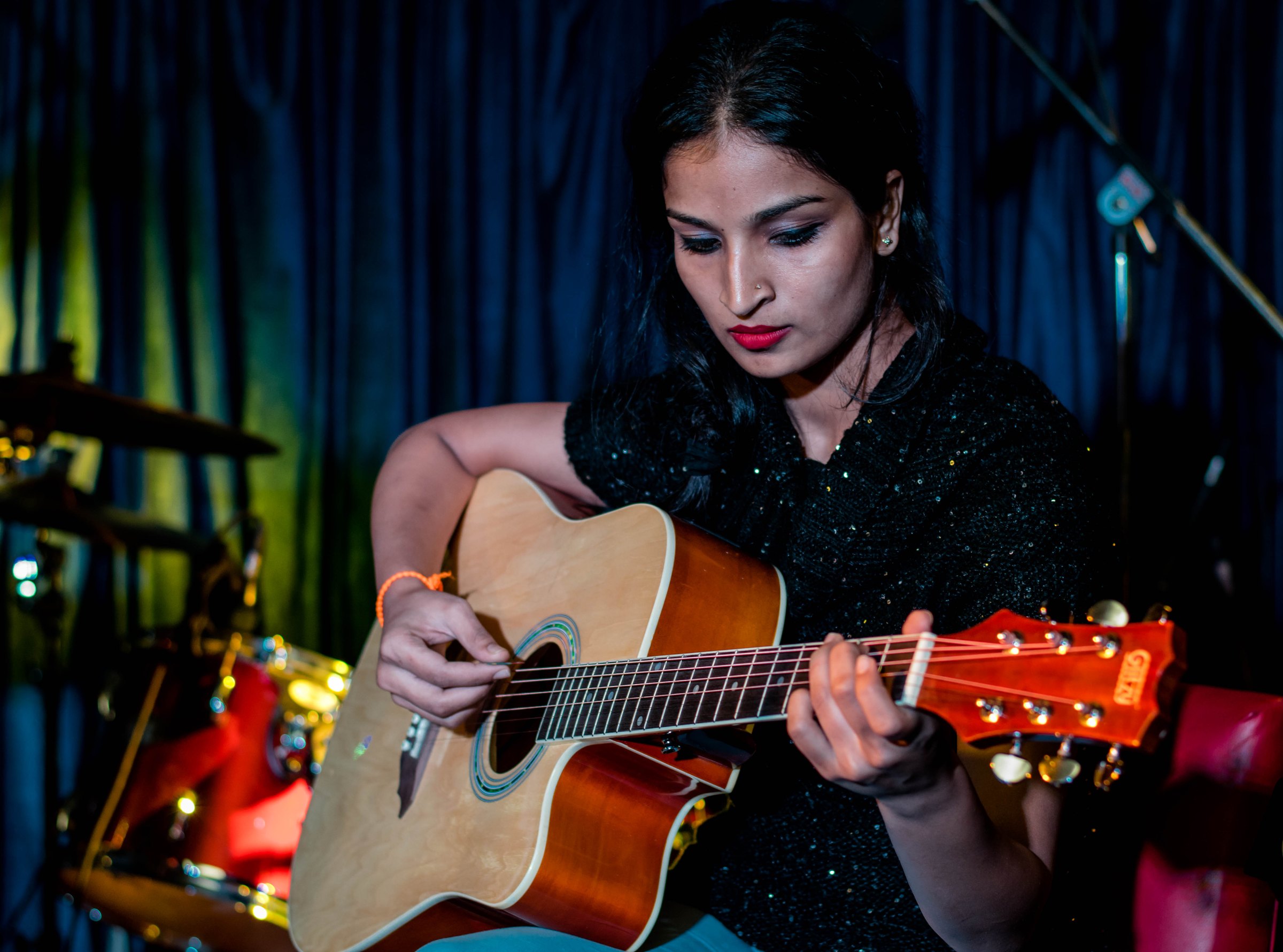 Woman playing acoustic guitar