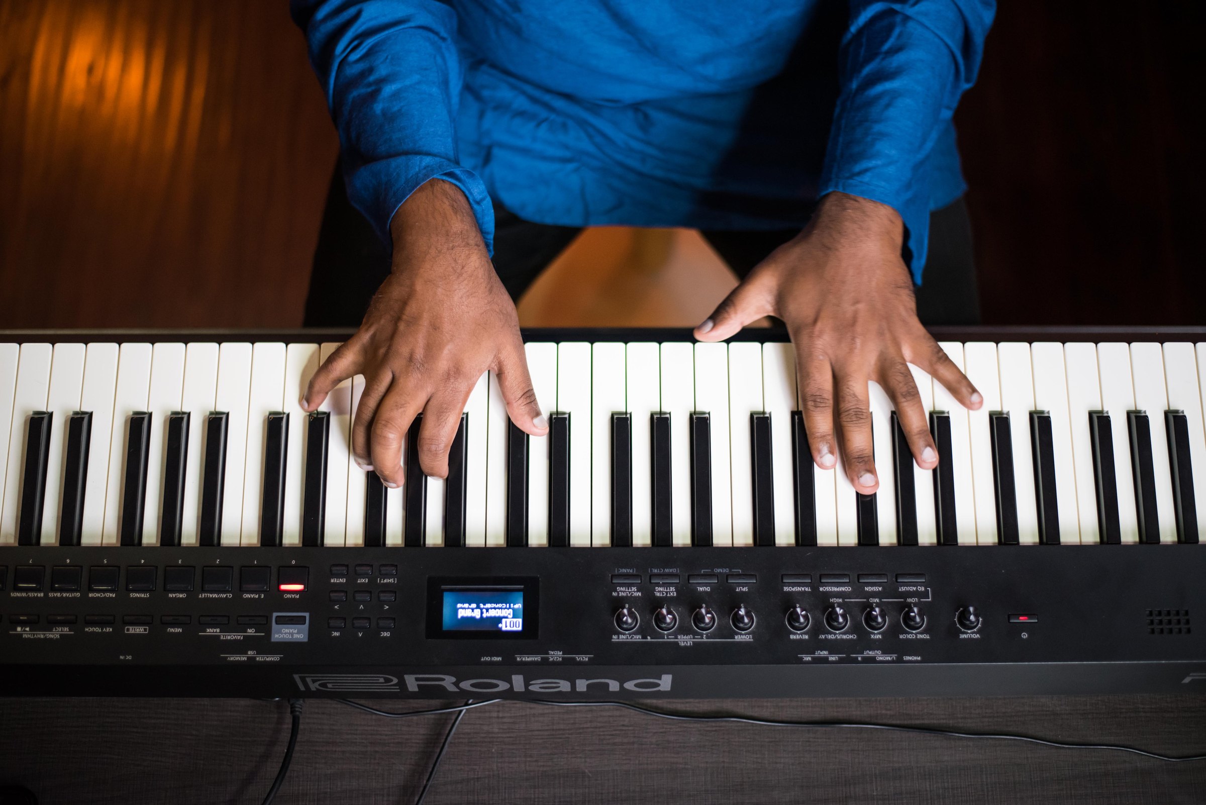 Hands at the keyboard, top-down