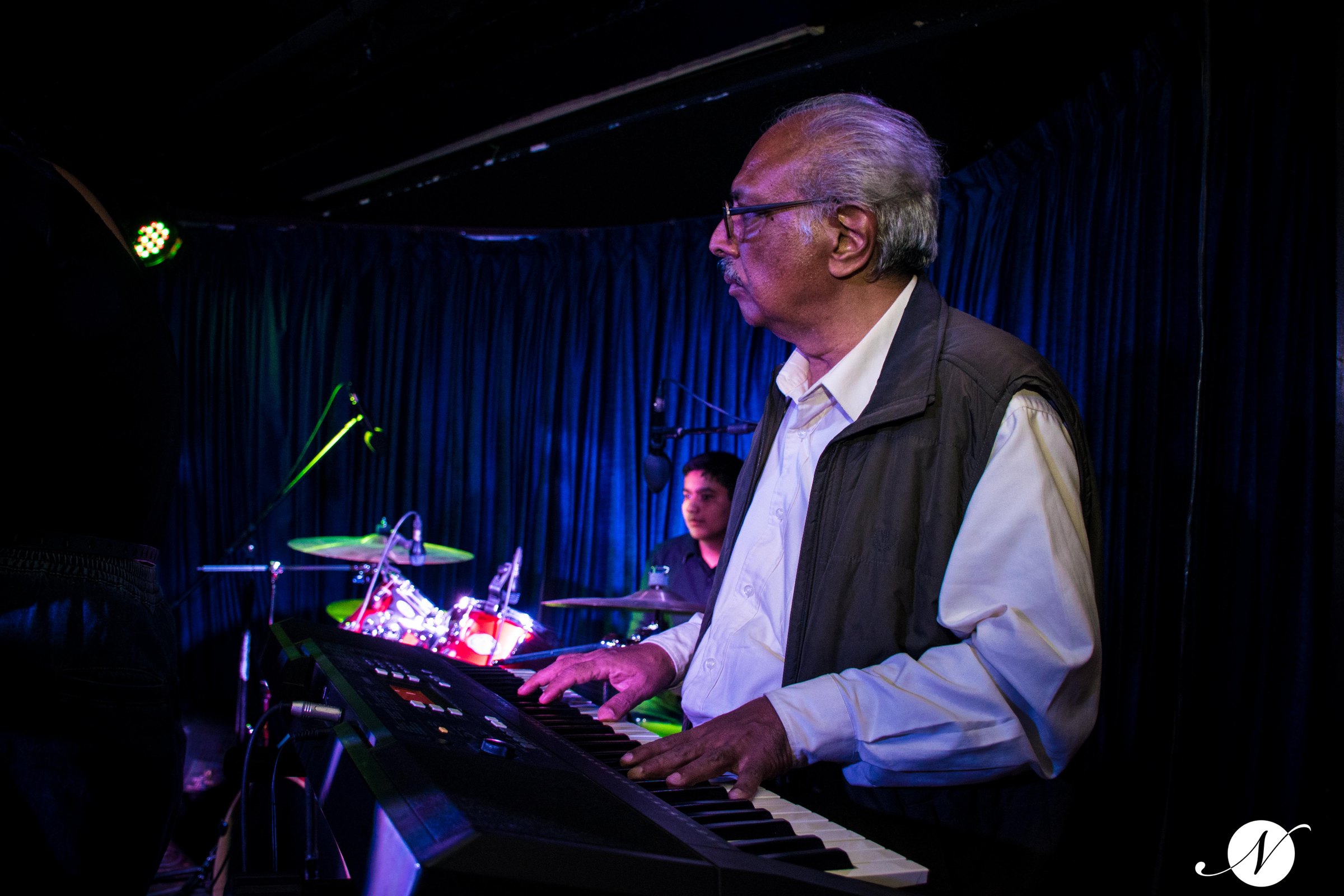 Senior student at the keyboard on stage