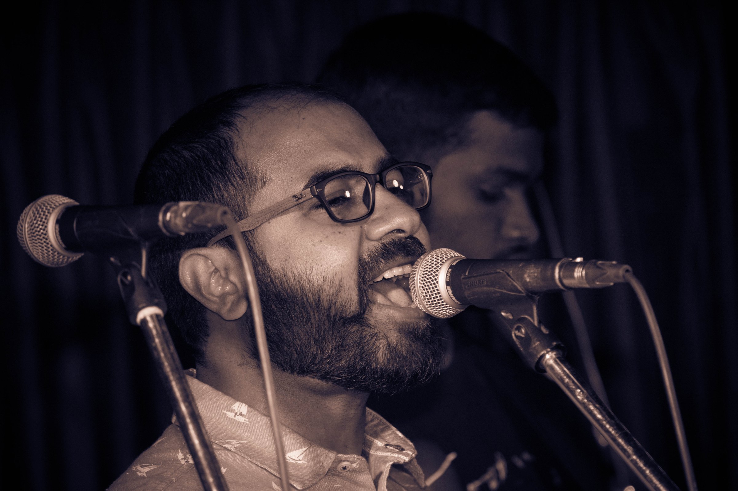 Singer at two microphones