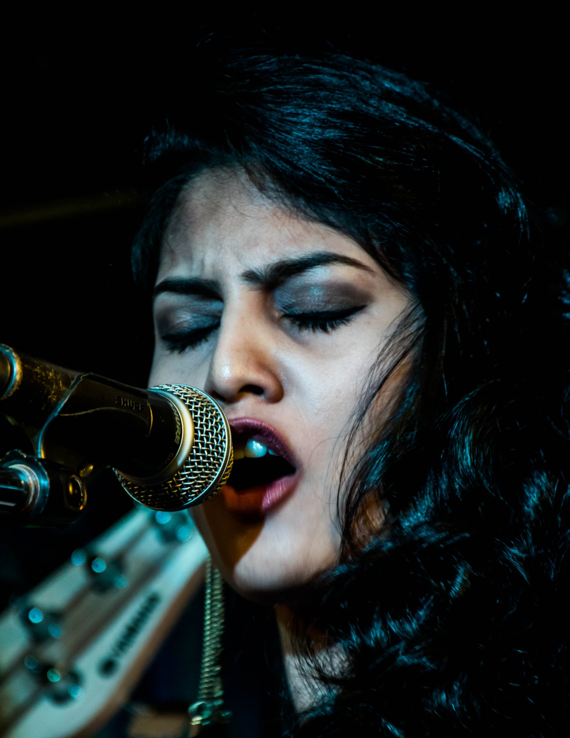Singer at stage microphone